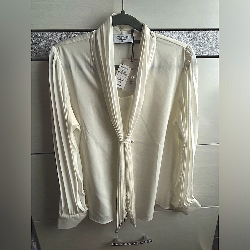 Ivory blouse with pearl button details